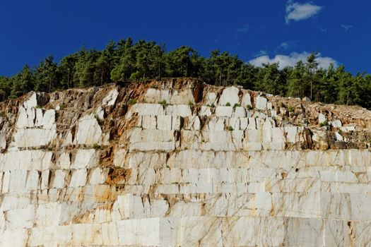 Detail of huge Thassos white marble quarry (mine) with grabber