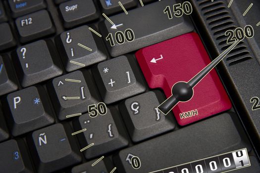 Black keyboard with red key and speedometer