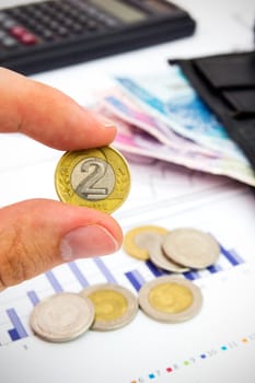 Polish coin in hand. Savings and banking concept