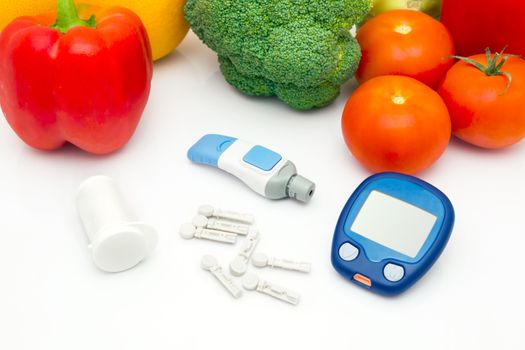 Glucose meter device with accessories. Vegetables and healthy lifestyle