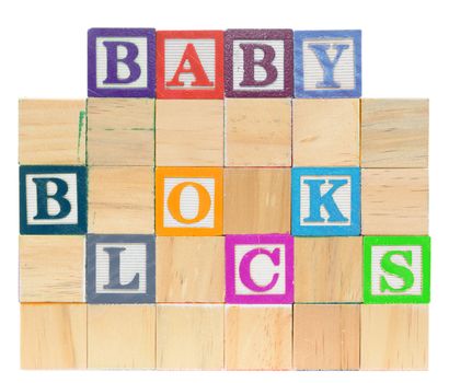 Letter blocks spelling baby blocks. Isolated on a white background.