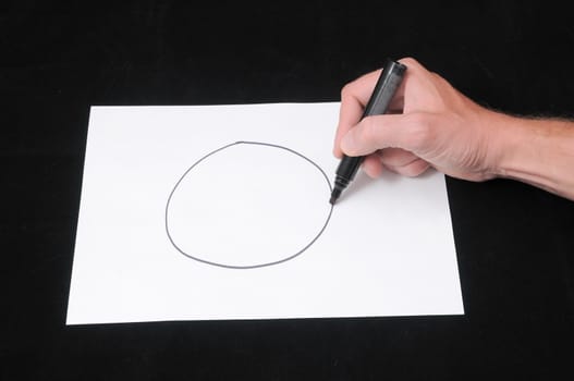 A Caucasian Male Hand Drawing on a White Paper