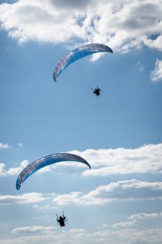 The recreational and competitive adventure sport of flying paragliders.