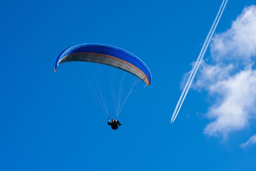 The recreational and competitive adventure sport of flying paragliders.