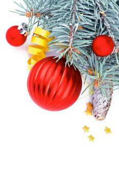 Frame of Blue Spruce Branches with Hoarfrost, Red Balls and Yellow Party Streamer isolated on white background