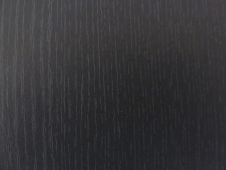 Dark artificial wood surface as a background