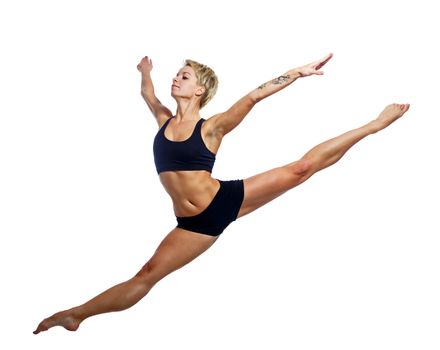 Attractive dancer leaping isolated on a white background, shot in studio