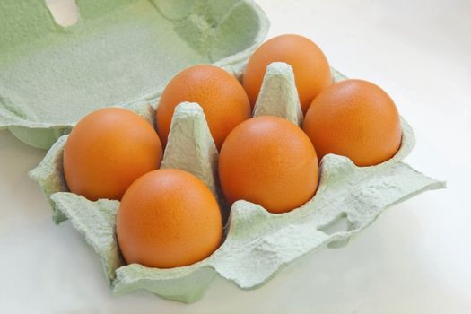 six eggs in a container