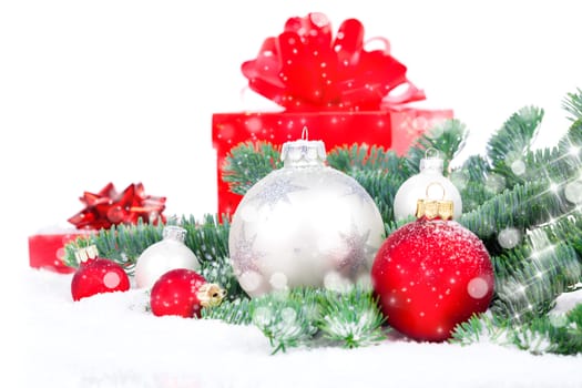 christmas red gift with festive decorations on snow background