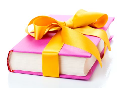 The book with a bow on a white background