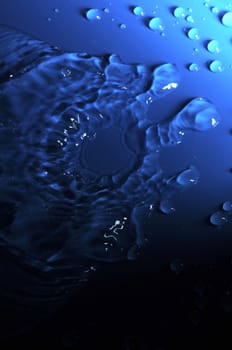 Some Water Drops on a Blue Textured Background