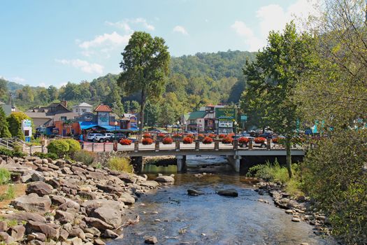 GATLINBURG, TENNESSEE - OCTOBER 6: The Little Pigeon River in Gatlinburg, Tennessee on October 6, 2013. Gatlinburg is a major tourist destination and gateway to Great Smoky Mountains National Park.