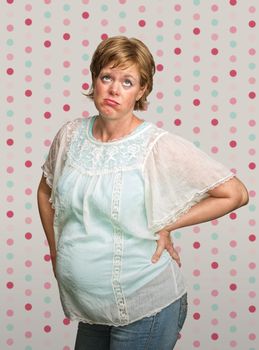 Pregnant European female with eyes rolled up