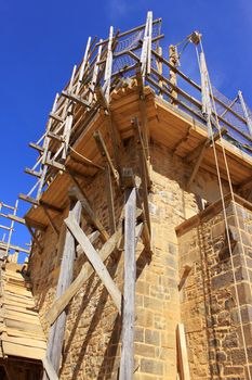 scaffolding for the construction and renovation of a medieval castle