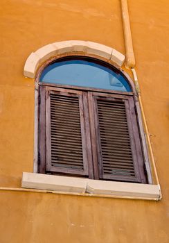 Vintage window on orange  cement wall can be used for background