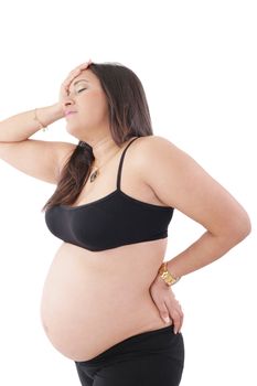 Pregnant woman standing with headache