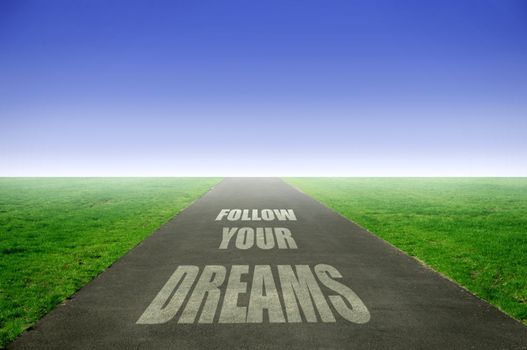 Open road with follow your dreams text 