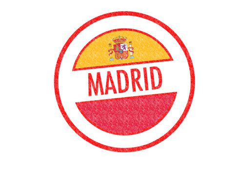 Passport-style MADRID rubber stamp over a white background.