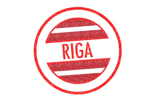 Passport-style RIGA rubber stamp over a white background.