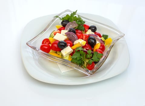 salad of fresh vegetables, shot on a sheet of white plastic, close-up