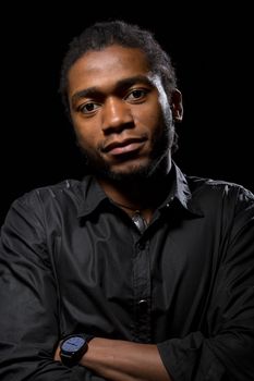 Portrait of a handsome African-American on a black background