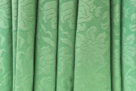 Green retro curtain as a textured background