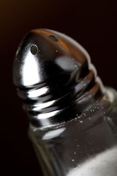 Macro closeup of a salt shaker top.  Shallow depth of field.