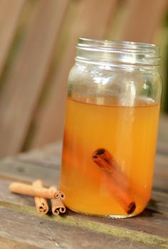 apple cider and cinnamon in mason jar 