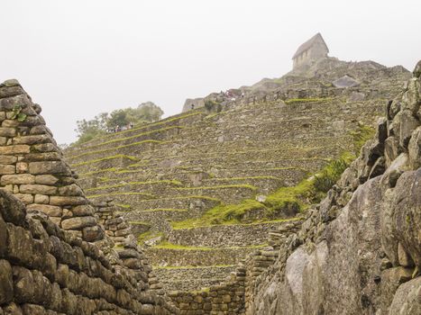 The Watchman's Hut on the top of Terraced Fields in the upper Agricultural Sector in a pre-Columbian 15th-century Inca site of the lost Inca city Machu Picchu, Andes mountains, Urubamba, Cusco, Peru.