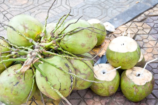 coconut and coconut juice on the ground food from nature