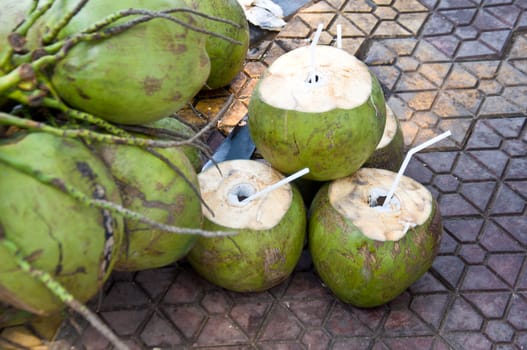 coconut and coconut juice on the ground food from nature