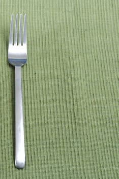 fork on place mat with copy space or room for text