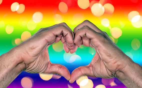 gay marriage, love or relationship with rainbow background and hands making heart