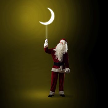 Santa Claus holding a string of luminous glowing moon