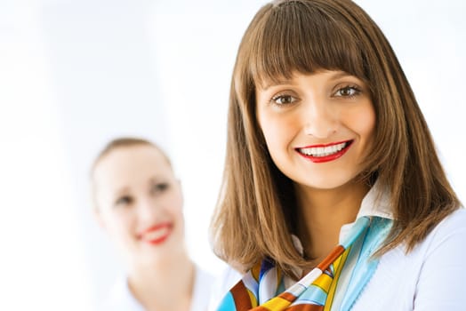 young successful business woman smiling and looking in camera