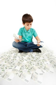 boy sitting on money, money concept, how to be successful, isolated on white background