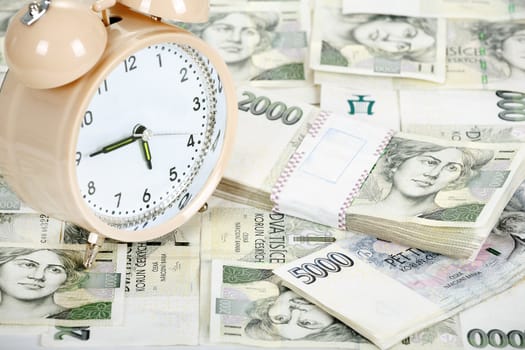 time is money business concept with czech banknotes crown