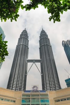KUALA LUMPUR - JUN 15: Petronas Towers and Suria KLCC on Jun 15, 2013 in Kuala Lumpur, Malaysia. The towers were the tallest buildings in the world from 1998 to 2004  (451.9 m). 