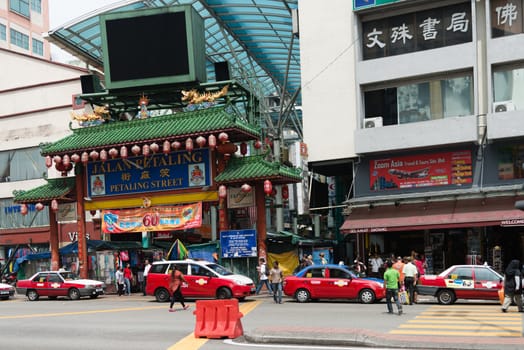 KUALA LUMPUR - JUN 15: Gateway to Jalan Petaling in Chinatown on Jun 15, 2013 in Kuala Lumpur, Malaysia. It is famous tourist place with bustling market and crowded cafes.
