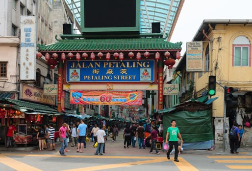 KUALA LUMPUR - JUN 15: Gateway to Jalan Petaling in Chinatown on Jun 15, 2013 in Kuala Lumpur, Malaysia. It is famous tourist place with bustling market and crowded cafes.