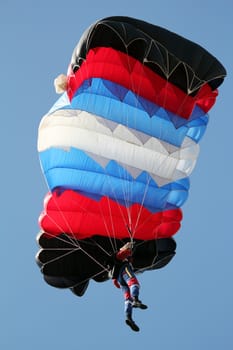 parachutist on blue sky extreme sport