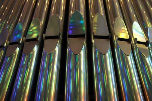 front view of silver organ pipes.