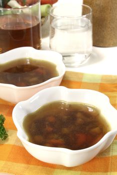 hot Beef Consomme on light background