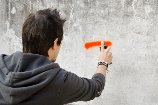 Graffiti artist about to start spraying a wall