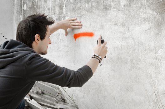 Graffiti artist about to start spraying a wall