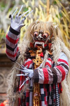 BALI - SEP 21: Rangda in Barong and Kris Dance performs at Sahadewah, in Batubulan, Bali, Indonesia on Sep 21, 2012. This famous play represents an fight between good and bad gods.