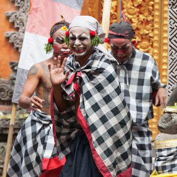 BALI - SEP 21: Clown Barong and Kris Dance performs at Sahadewah, in Batubulan, Bali, Indonesia on Sep 21, 2012. This famous play represents an fight between good and bad gods.