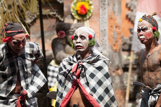 BALI - SEP 21: Clown Barong and Kris Dance performs at Sahadewah, in Batubulan, Bali, Indonesia on Sep 21, 2012. This famous play represents an fight between good and bad gods.