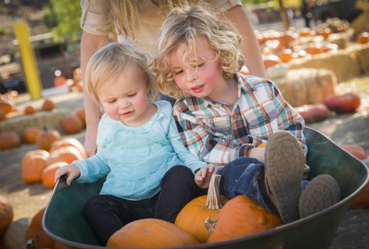 Adorable Young Family Enjoys a Day at the Pumpkin Patch.