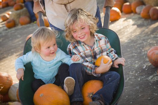 Adorable Young Family Enjoys a Day at the Pumpkin Patch.